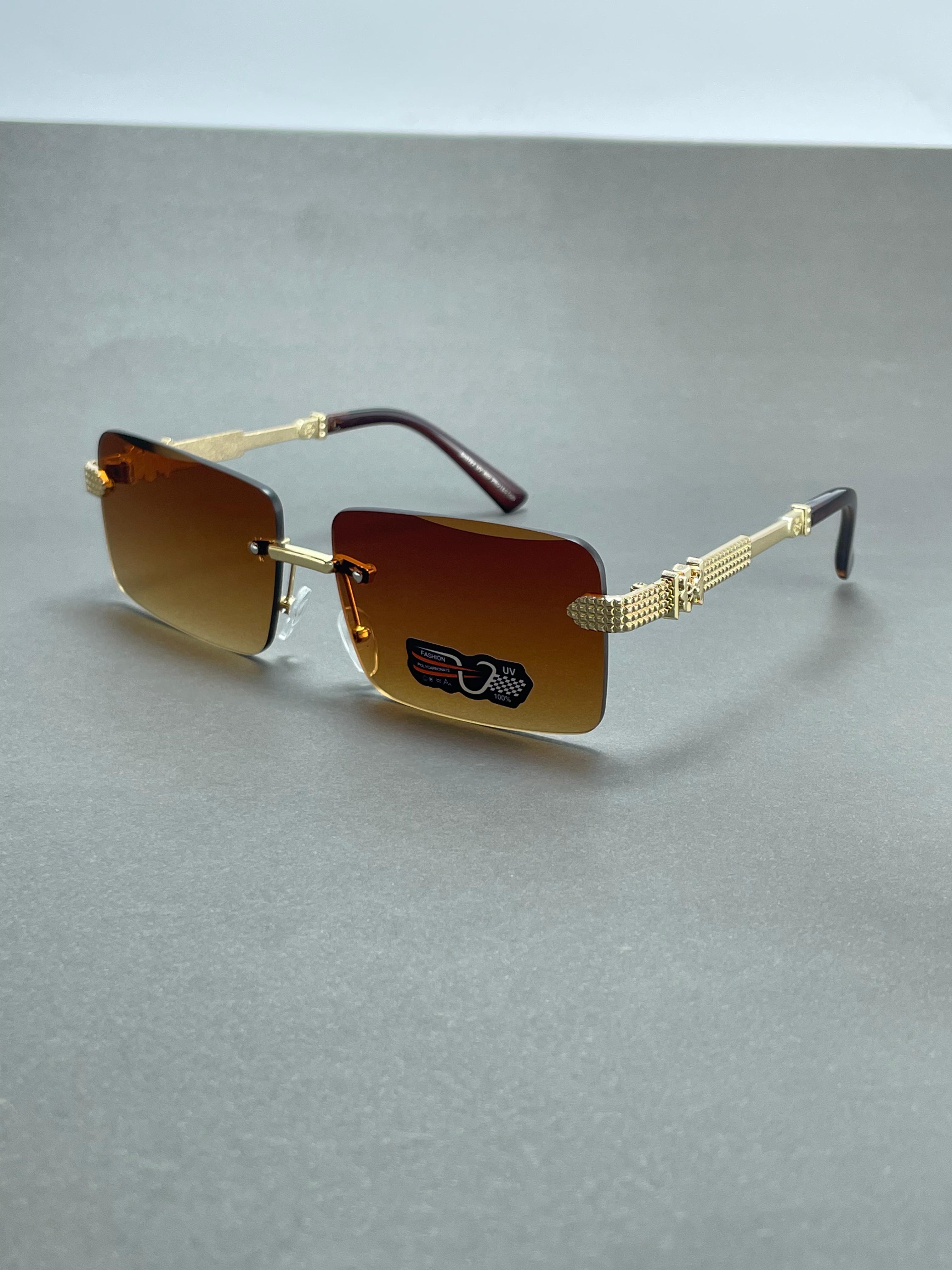 Gold rimmed sunglasses